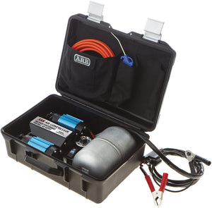 Black case with ARB air compressor, air tank, cables and hose in a case